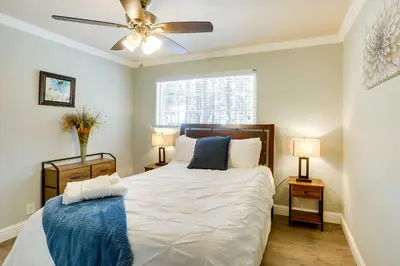 a bedroom with a large bed with two night stands at Welcoming South Lake Tahoe Rental Near Beaches in South Lake Tahoe