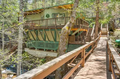 a tree house in the woods at Creekside Cabin By Calaveras Big Trees State Park in Camp Connell
