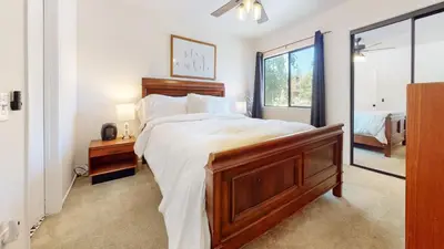 a bedroom with a large bed and a window at La Vista Blanc #16 condo in Mammoth Lakes