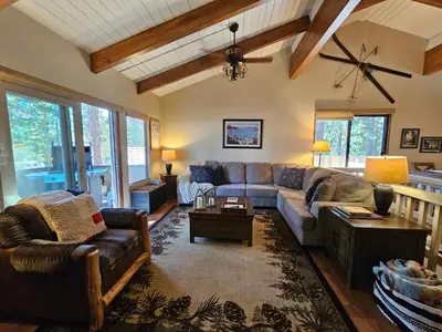 a living room with a couch and a table at Cozy Bear Lodge home in Incline Village