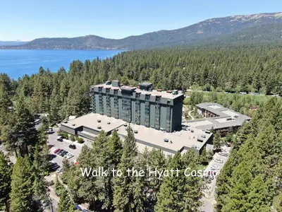 an aerial view of the kent castle hotel with a lake at Pinenut Place home in Incline Village
