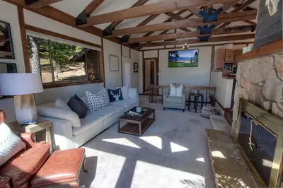 a living room with a couch and a fireplace at Inclining View home in Incline Village