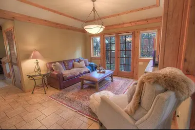 a living room with a couch and a table at Third Creek Comfort townhouse in Incline Village