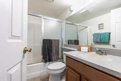 a bathroom with a white toilet and a sink at 2BR Townhome Walk to Beach or Trails in Carnelian Bay