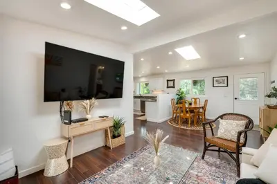 a living room with a couch and a table at Modern Meadow Vista Vacation Home with Spacious Deck in Meadow Vista