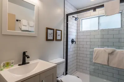 a bathroom with a sink and a toilet and a mirror at Tyrolean Village 6 2 Bedroom 1 and a Half Bath Sleeps 6 Walk to Lift Steps to town shuttle in Mammoth Lakes