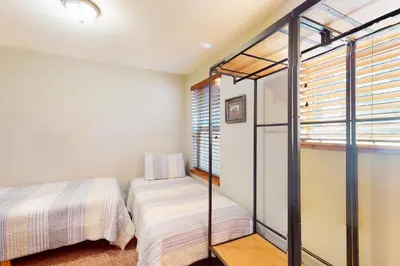 a bedroom with two beds and a window at Kings Beach Retreat in Kings Beach