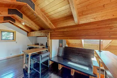 a room with a wooden ceiling with a wooden table at Epic Mountain Escape in Tahoe Vista