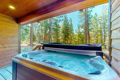 a jacuzzi tub in a cabin in the woods at Epic Mountain Escape in Tahoe Vista