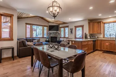 a kitchen and living room with a table and chairs at Grayfox #4 3 Bedroom 3 Bathroom Sleeps 8 Walk to Village Gondola in Mammoth Lakes