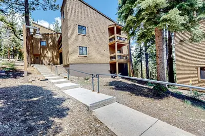 a building with a staircase in front of it at Powder Pines Retreat in Kingswood Estates