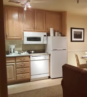 a kitchen with a white refrigerator and a microwave at GetAways at the Lodge at Kingsbury Crossing in Stateline