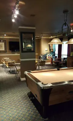 a room with a pool table and tables and chairs at GetAways at the Lodge at Kingsbury Crossing in Stateline