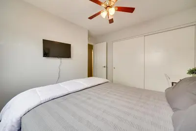 a bedroom with a bed and a ceiling fan at Centrally Located Reno Retreat with Patio and Yard in Reno