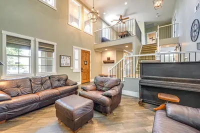 a living room with a couch and a piano at California Vacation Rental with Private Pool and Patio in Visalia