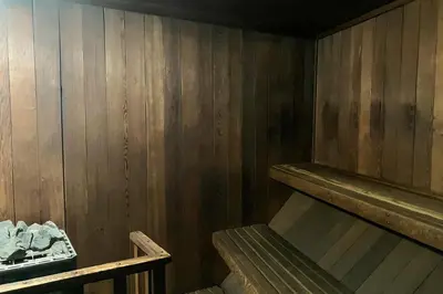 an empty room with a wooden wall and a wooden shelf at St Moritz 9 in Mammoth Lakes