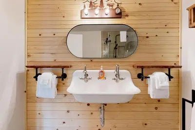 a bathroom with a sink and a mirror at Walling Mountain Retreat in Groveland