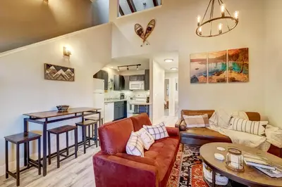 a living room with a couch and a table at Private condo steps from ski lift minutes to lake in Stateline