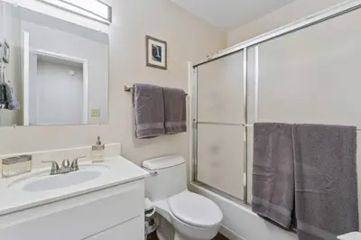 a bathroom with a toilet and a sink and a shower at 10 Mi to Palisades Tahoe! Condo with Game Room in Tahoe City