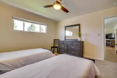 a bedroom with two beds and a ceiling fan at Relax Fireside! Tahoe Area Home 28 Mi to Slopes in Carson City