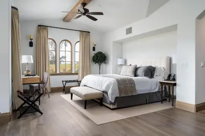 a bedroom with a bed and a ceiling fan at Grand Reserve Inn in Plymouth