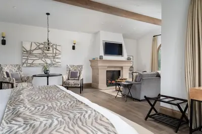 a bedroom with a bed and a fireplace at Grand Reserve Inn in Plymouth
