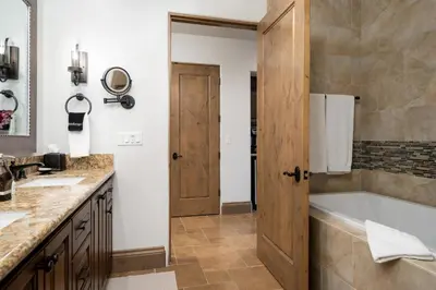 a bathroom with a tub and a sink at Grand Reserve Inn in Plymouth