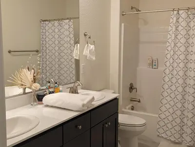 a bathroom with a sink and a toilet and a shower at Modern, Spacious & Relaxing Home in Sparks, NV in Sparks
