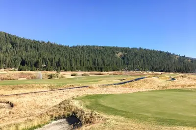 an aerial view of a golf course with trees at Resort at Everline Resort & Spa #558 in Olympic Valley