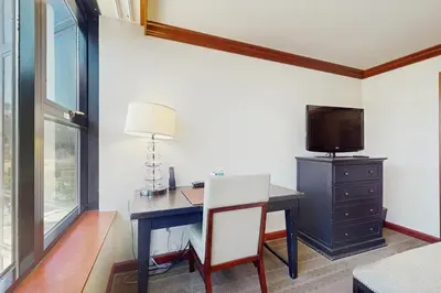 a room with a desk with a television and a desk sidx sidx sidx at Resort at Everline Resort & Spa #558 in Olympic Valley