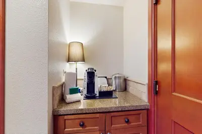 a hotel room with a coffee maker on a counter at Resort at Everline Resort & Spa #558 in Olympic Valley
