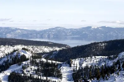 a view of a snow covered mountain and a lake at Resort at Everline Resort & Spa #560 in Olympic Valley