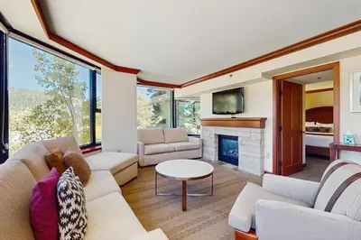 a living room with a couch and a fireplace at Resort at Everline Resort & Spa #560 in Olympic Valley