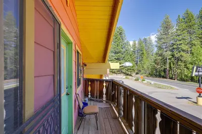 a balcony of a building with a chair on it at Pinecrest Dodge Ridge Cabin Shared Outdoor Space in Cold Springs