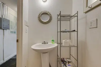 a bathroom with a sink and a mirror at Dodge Ridge Pinecrest Mountain Cabin Near Hiking! in Cold Springs