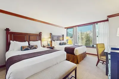 a hotel room with two beds and a window at 556 Everline in Olympic Valley