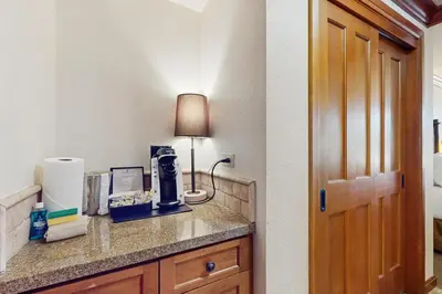 a hotel room with a counter with a lamp on it at 556 Everline in Olympic Valley