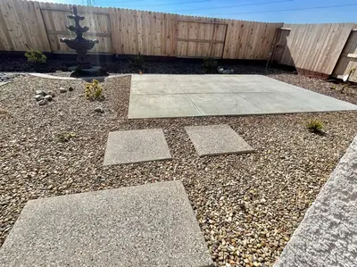 a garden with a fence and a stone patio at Brand-New, Beautiful & Stylish Home in Sacramento! in Sacramento