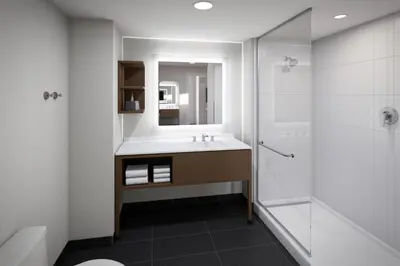 a bathroom with a sink and a shower at Staybridge Suites Manteca by IHG in Manteca