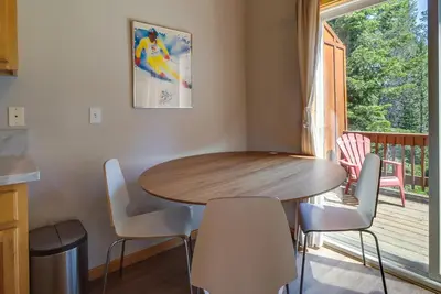 a dining room with a table and chairs and a window at Truckee Retreat with Fireplace and Community Amenities in Truckee