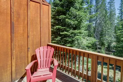 a pink chair sitting on the deck of a house at Truckee Retreat with Fireplace and Community Amenities in Truckee