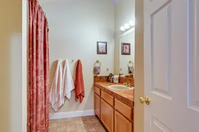 a bathroom with a sink and a mirror at Groveland Vacation Rental Near Pine Mountain Lake! in Groveland
