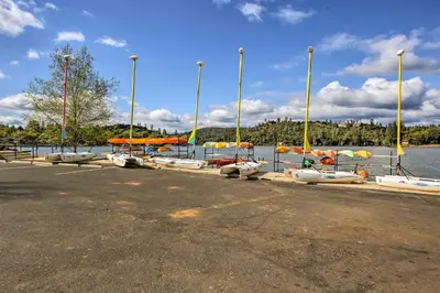 a bunch of boats are parked next to the water at Groveland Vacation Rental about 26 Miles to Yosemite! in Groveland