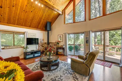 a living room with a couch and chairs and a tv at Groveland Vacation Rental about 26 Miles to Yosemite! in Groveland