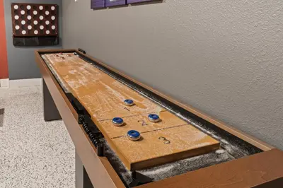 a ping pong table in the corner of a room at Sierra Mountain Escape - Brand new spa/game room in Oakhurst