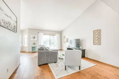 a living room with a couch and a table at Stylish 3BR/2BA Retreat w/ Pool! Dream Getaway in Fresno