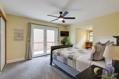 a bedroom with a bed and a ceiling fan at Mi-Wuk Village Vacation Rental with Multi-Level Deck in Mi-Wuk Village