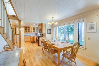 a kitchen and dining room with a table and chairs at 2 Mi to Lake Tahoe Spacious and Serene Retreat! in Tahoe City