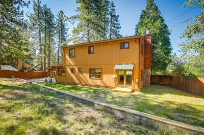 a small house in the middle of a yard at 2 Mi to Lake Tahoe Spacious and Serene Retreat! in Tahoe City