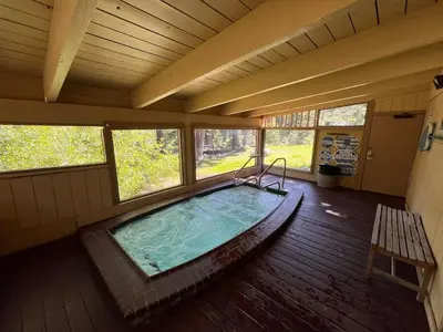 an overhead view of a large indoor pool in a house at Cozy Ski Condo - Walk to Canyon - Dog Friendly in Mammoth Lakes